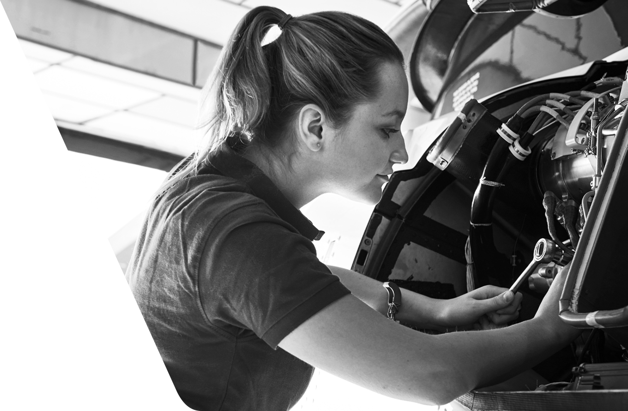 woman mechanic working on airplane