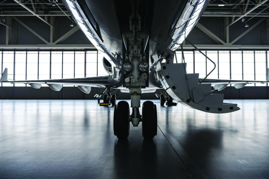 Luxury private jet plane in aviation hangar