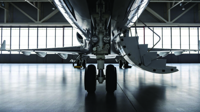 Luxury private jet plane in aviation hangar